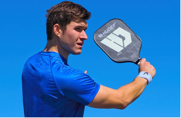 professional pickleball player swinging paddle - What Is the Right Pickleball Paddle for Me? 
