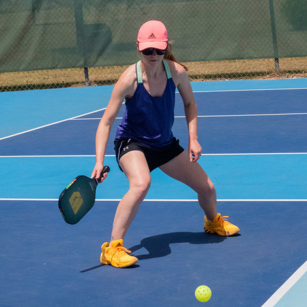 A young woman using HUDEF’s HD5 thicker pickleball paddle
