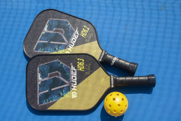 Player making a pickleball serve
