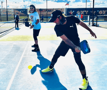 Pickleball players with paddles